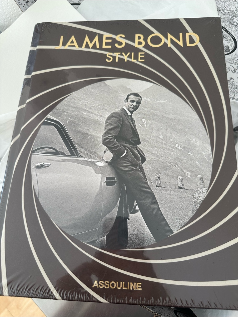 Assouline James Bond Style Hardcover - Brown and Gold in Large size.